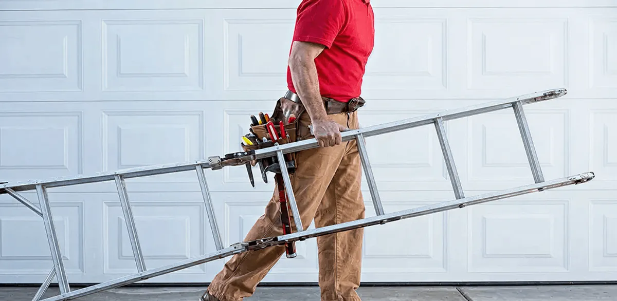 Garage door repair technician arriving with tools and ladder in Sacramento, CA